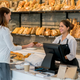 Illustration for article titled Cashier Forced To Incorporate Humiliating New Phrase Into Every Customer Interactionem/em